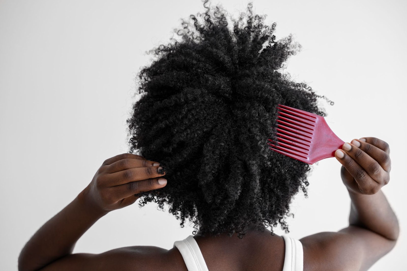 A Lady Trying to Comb Her Hair