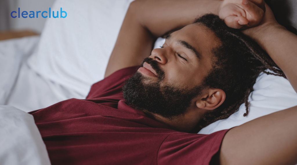 Athlete asleep in bed, possibly wearing a sports guard meant for daytime use
