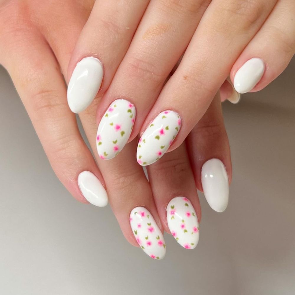 Simple White Nail Design having baby flower on White nails