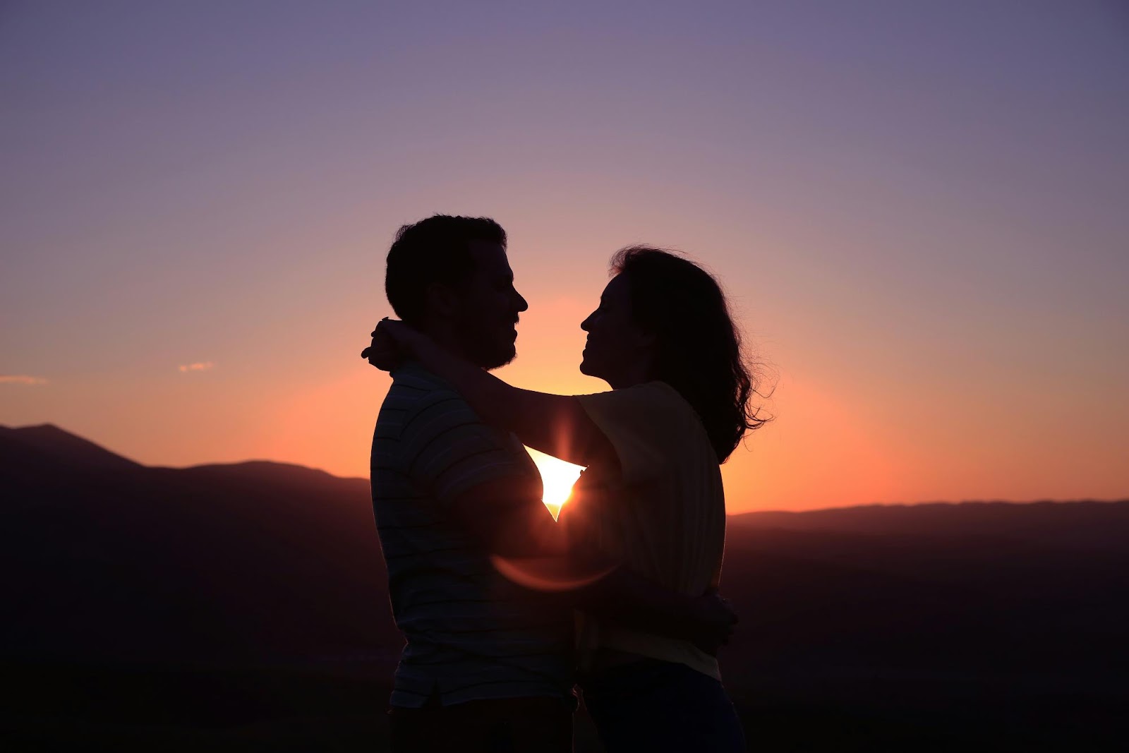 a man and woman kissing