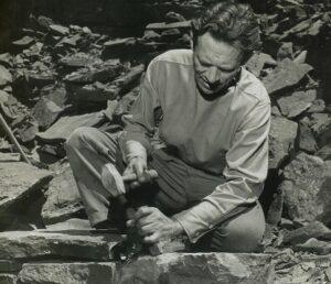 A person sitting on rocks

AI-generated content may be incorrect.