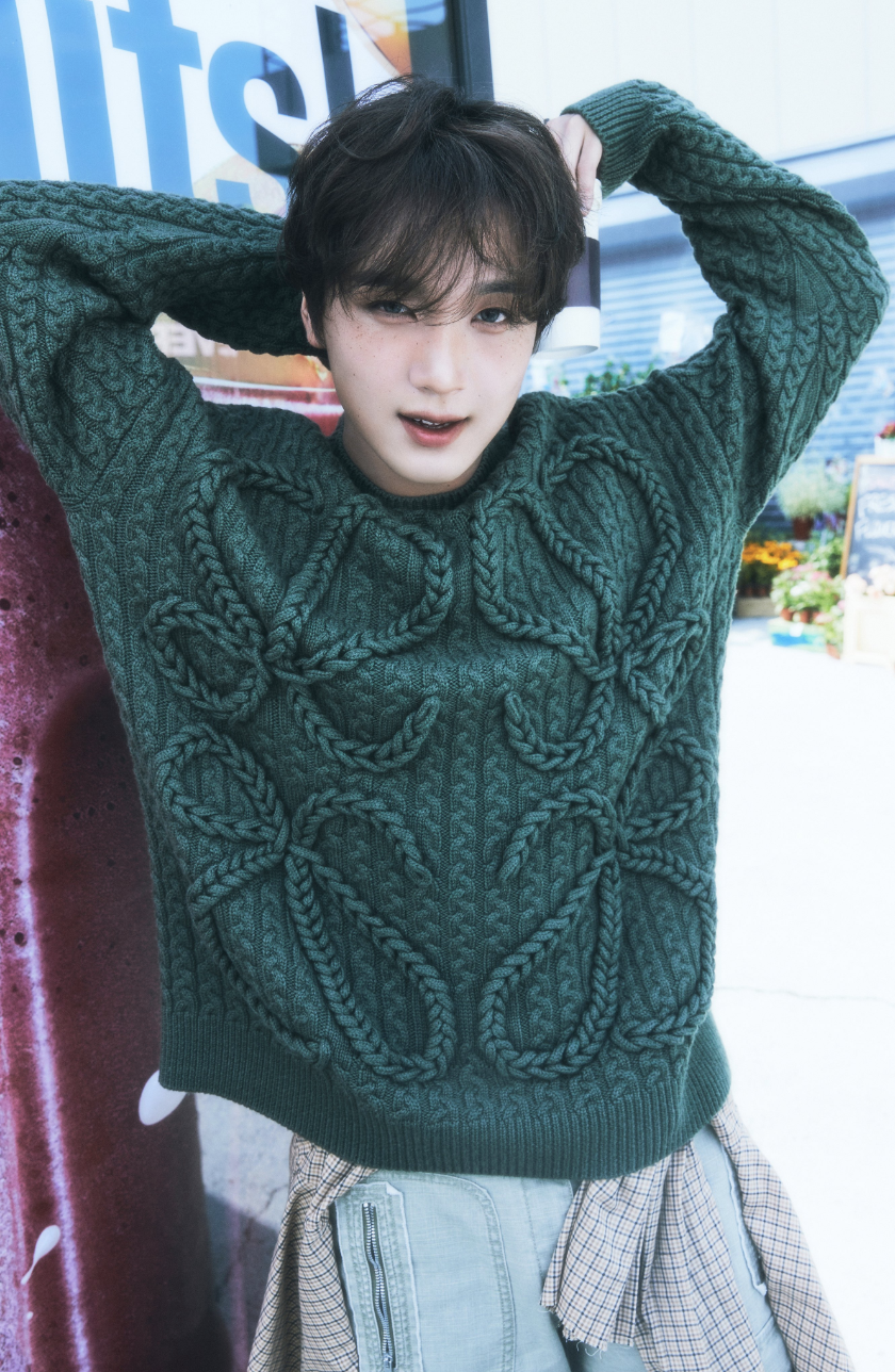 A picture of NCT Haechan recent look wearing a green wooden sweater 