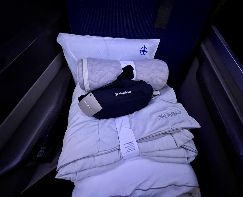 The amenity kits, blankets, and pillows in United Polaris Business Class. 