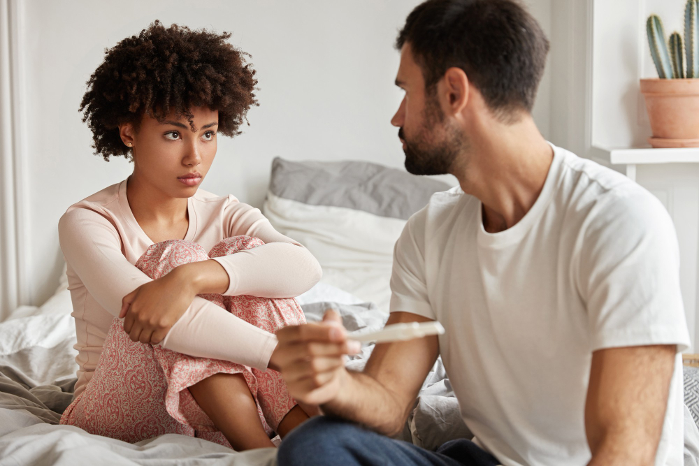 frustared-dark-skinned-woman-cant-get-pregnant-try-solve-infertility-problem-together-with-husband-sit-together-bed-2.jpg