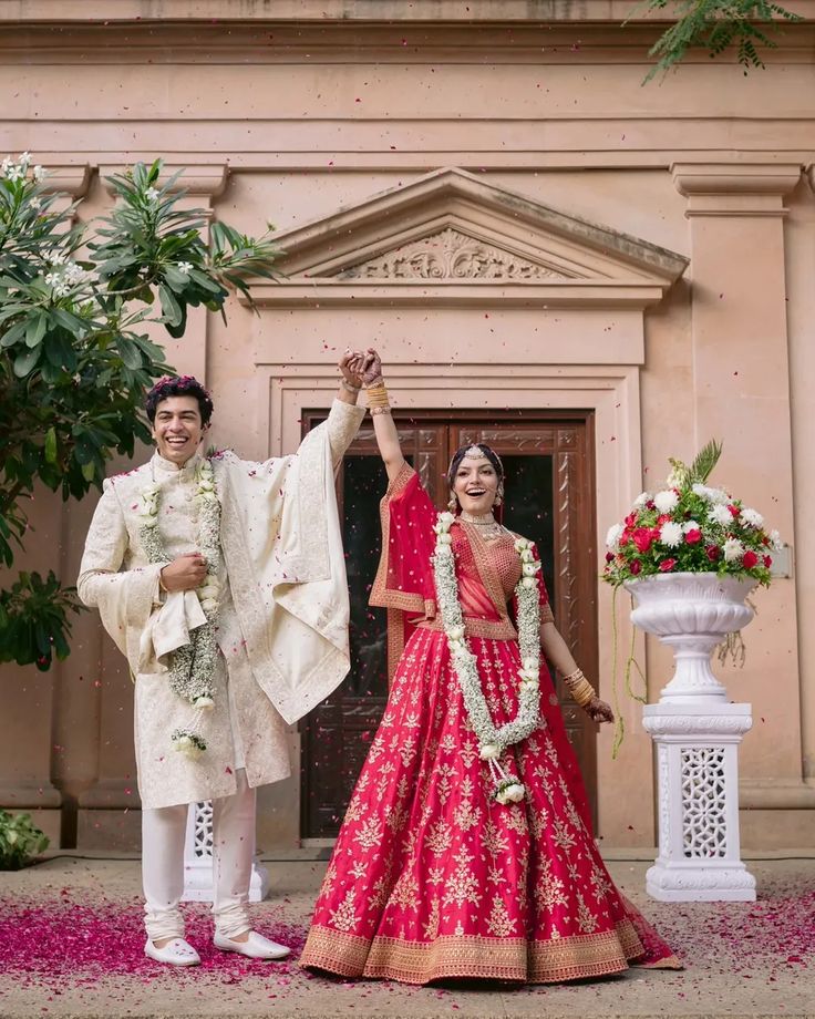 Candid wedding moment of the couple hyping up after the varmala, capturing their pure happiness and excitement.