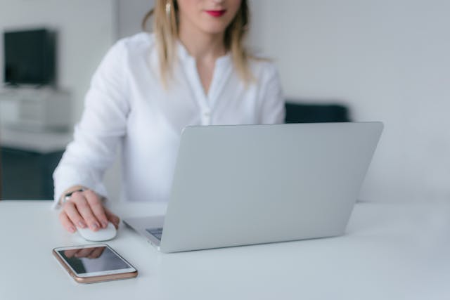 person researching the market on computer