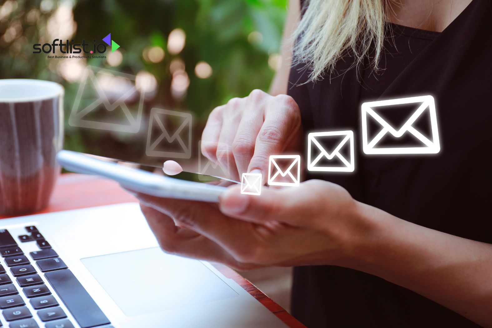 Person using a phone with email icons appearing in the air.