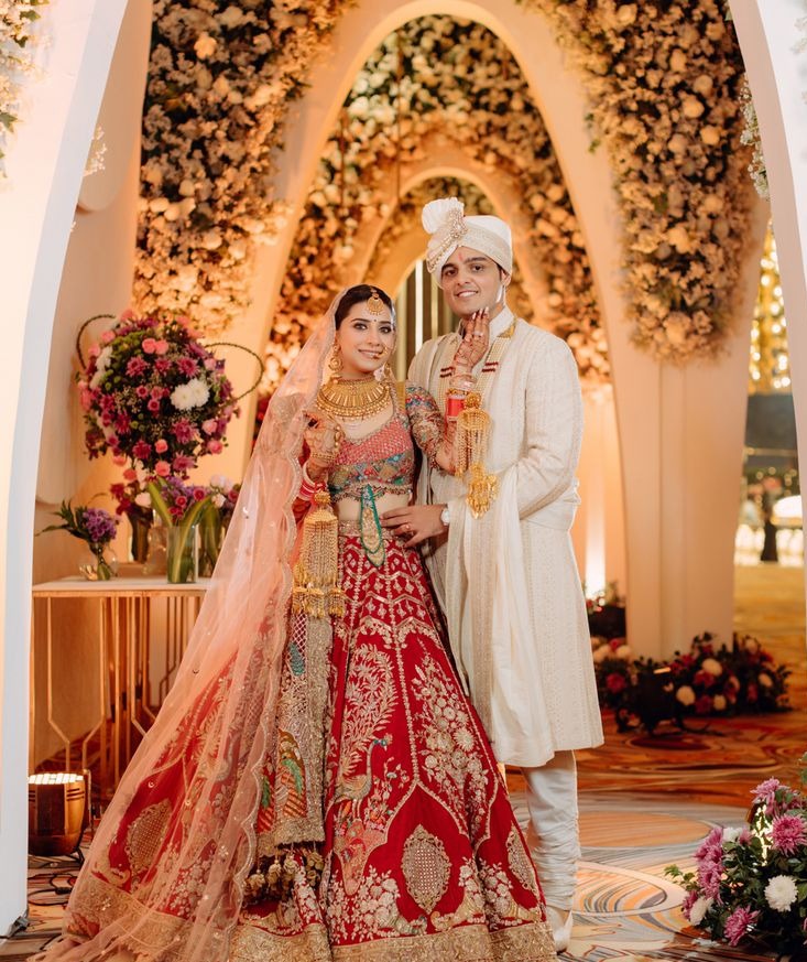 Couple in wedding dress and suit, standing together with beautiful lighting for a breathtaking wedding photo.