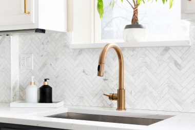 ways to know that your remodeling project is substantially complete bronze finished kitchen faucet with herringbone pattern backsplash custom built michigan