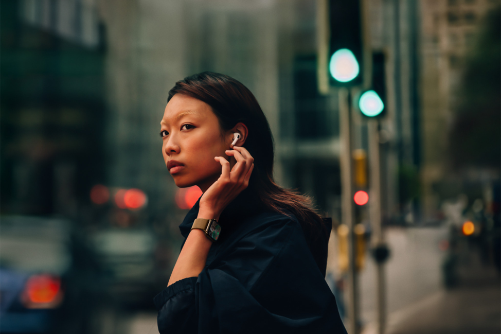 Woman wearing Apple Watch Series 10 with white ear pods.  Stay connected to the people and things that you care about most. Cellular lets you keep in touch, even when you don’t have your iPhone nearby.