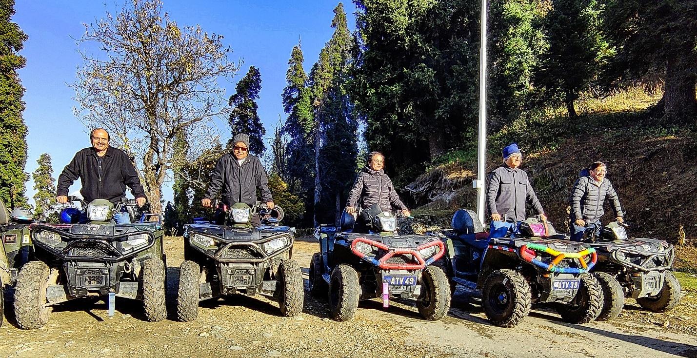 A group of people on atvs

Description automatically generated