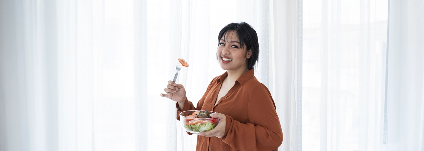 a mum eating her salad