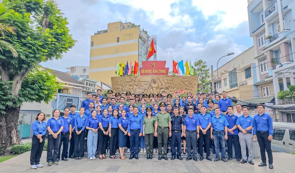 A group of people in blue shirtsDescription automatically generated