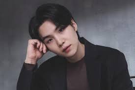 A picture of BTS members Suga