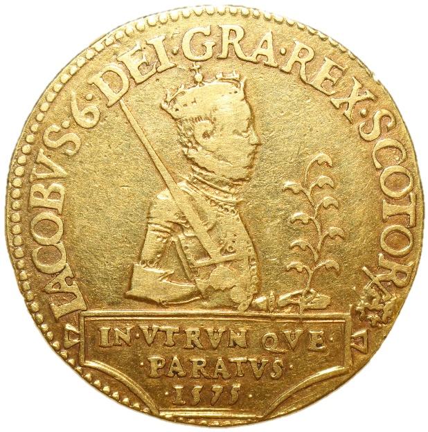 A gold coin with a person in a crown

Description automatically generated