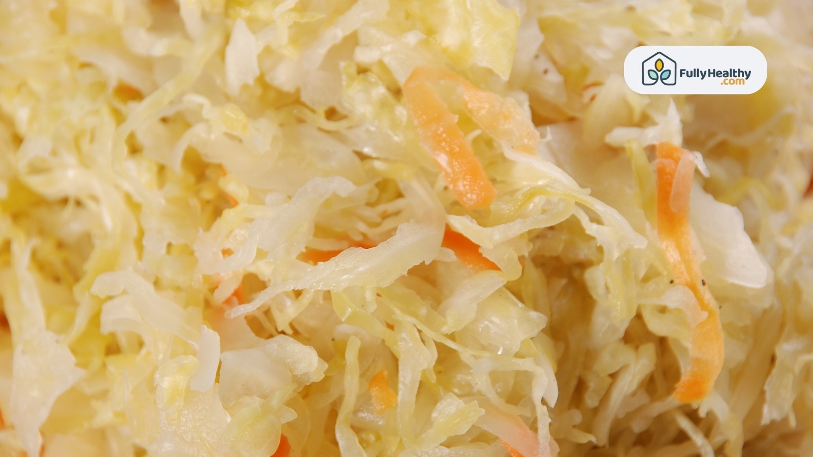 Close-up of shredded sauerkraut with carrot strands and seasoning