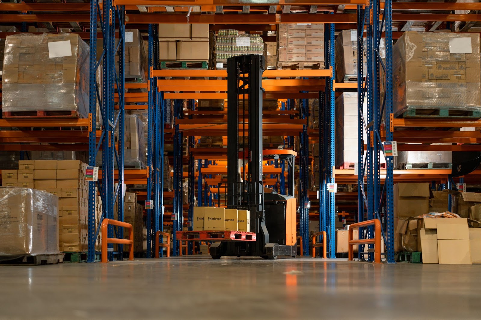 Inventory management in a warehouse with neatly stacked FMCG products ready for fulfillment.