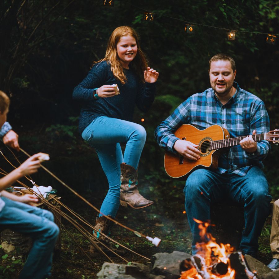 family singing around the campfire