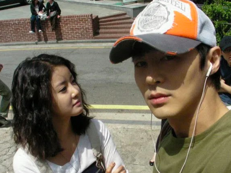 This contains an image of SHINHWA’s Junjin and Lee Si Young