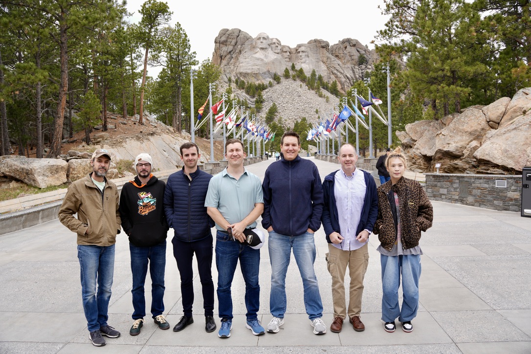 Team in front of Mount Rushmore