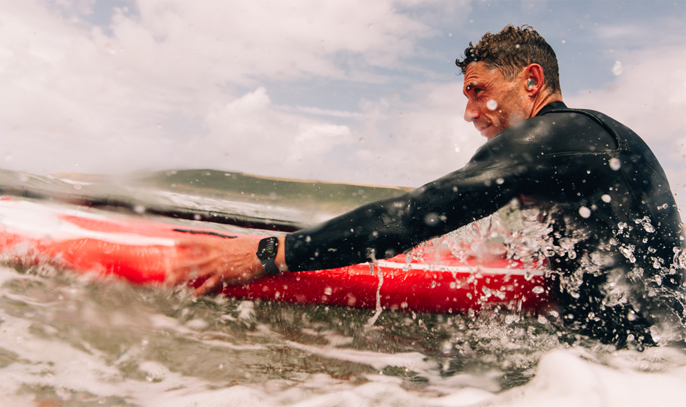 Man rowing on a canoe wearing Apple Watch Series 2 for water sports. Apple Watch Series 10 an even better companion when users are headed into the water.
