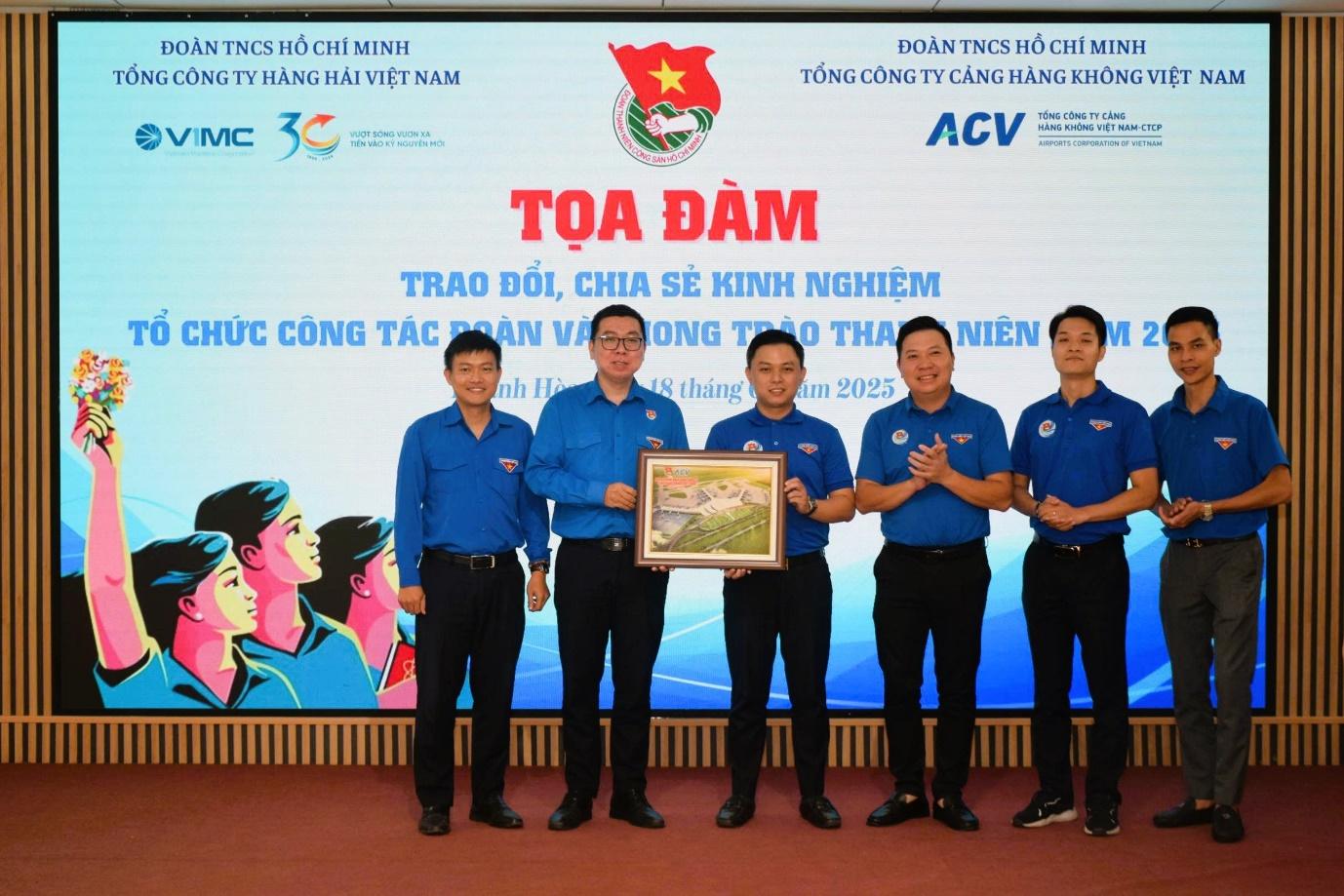 A group of men standing in front of a large screenAI-generated content may be incorrect.