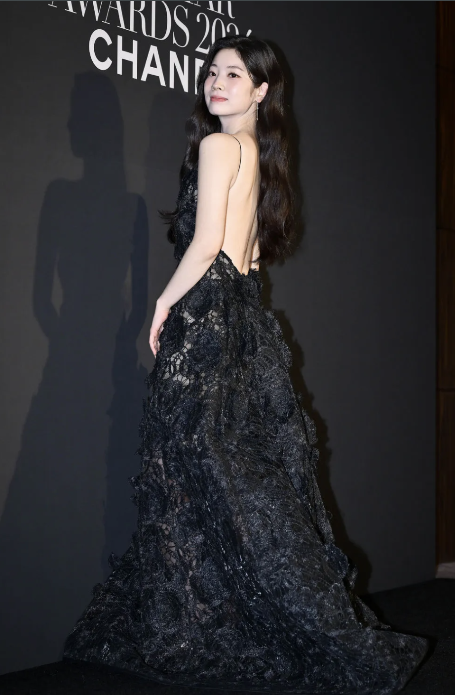 A picture of TWICE's Dahyun wearing a daring backless dress at the 2024 Marie Claire Korea Asia Star Awards during the Busan International Film Festival (BIFF). 