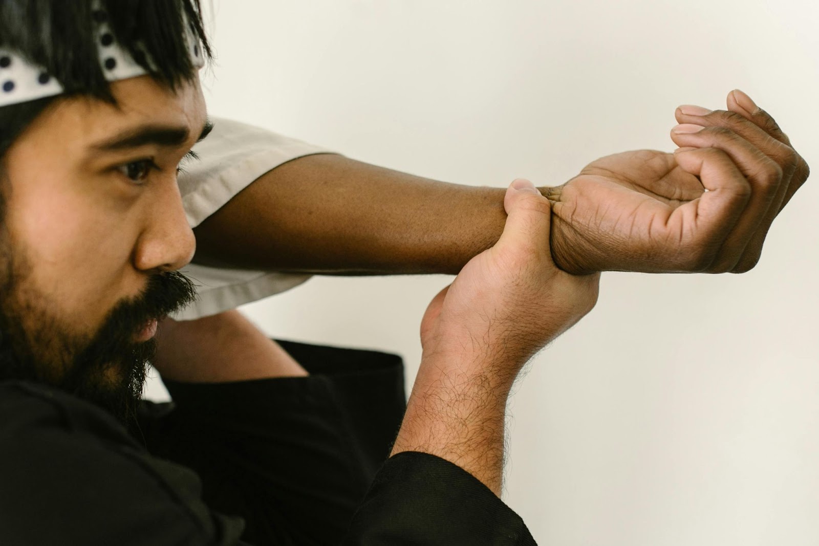 A martia arts instructor demonstrating a wristlock move