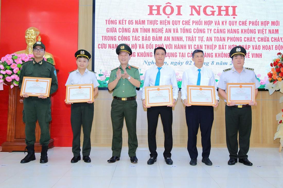 A group of people in uniform holding certificatesDescription automatically generated