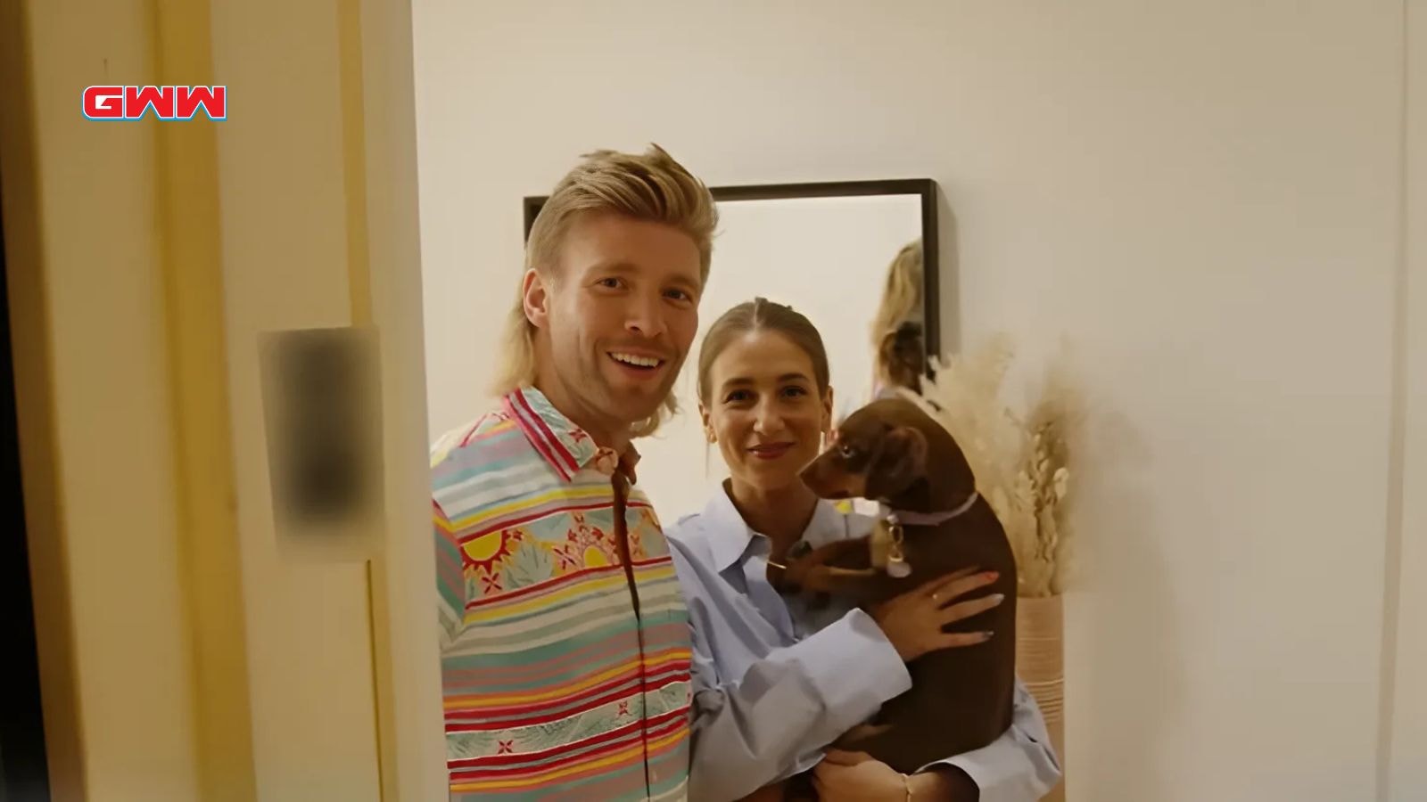 Kyle Cooke and Amanda Batula with their dog