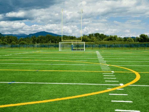 &nbsp;synthetic turf football field with goalposts and clear field markings