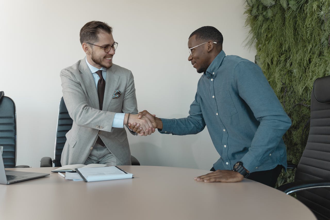 A man welcoming an applicant as part of how to outsource your bookkeeping