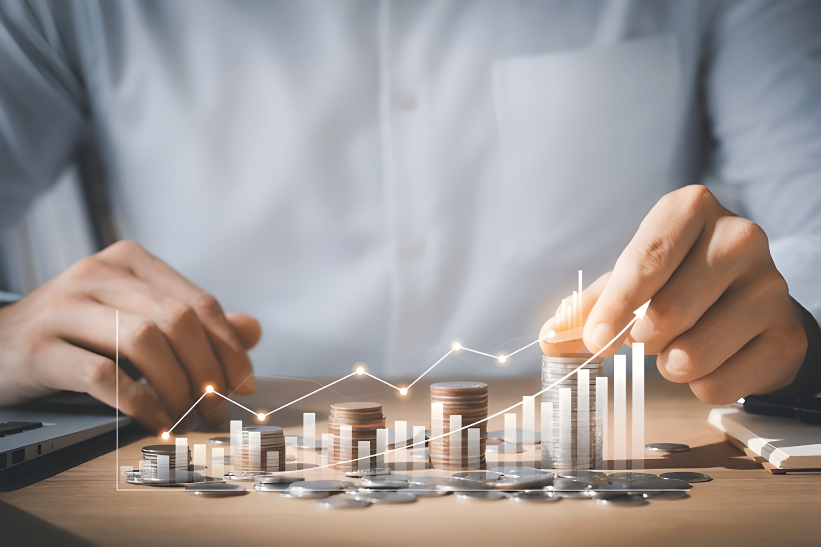 "Close-up of a businessperson stacking coins with a digital overlay of a rising graph, symbolizing financial growth and long-term success.