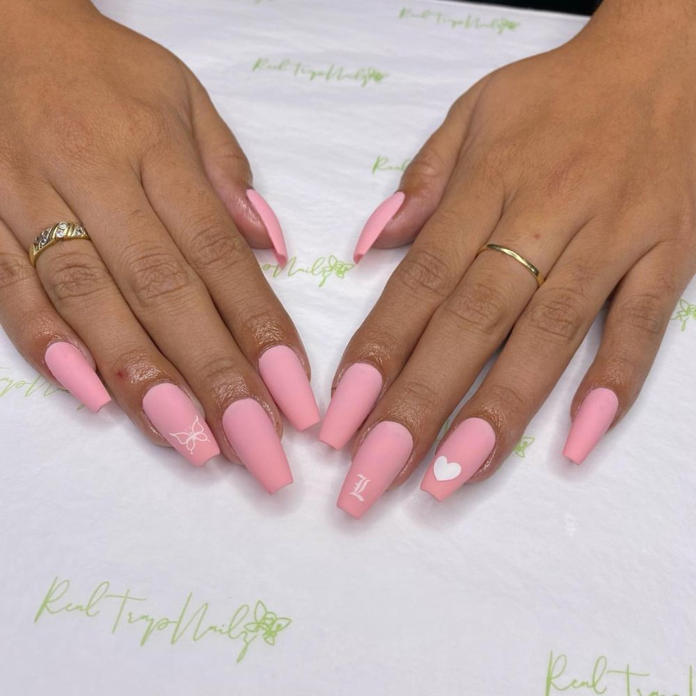 Close up of nails with simple pink nail designs having classic Pink Nails