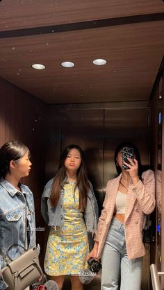 This contains an image of the Ha Sisters standing in an elevator 