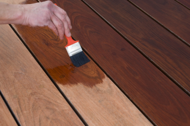 ways to prepare your deck for a michigan winter brushing new stain onto wood decking custom built okemos