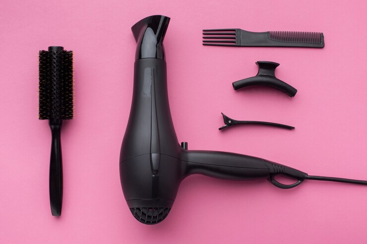 Hair Styling Tools on a pink background