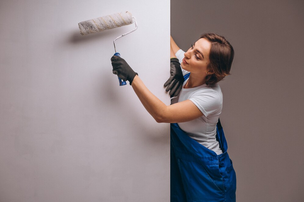 woman painting a wall 