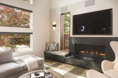 top lighting ideas for your living room remodel wall sconce next to tv and fireplace area custom built michigan