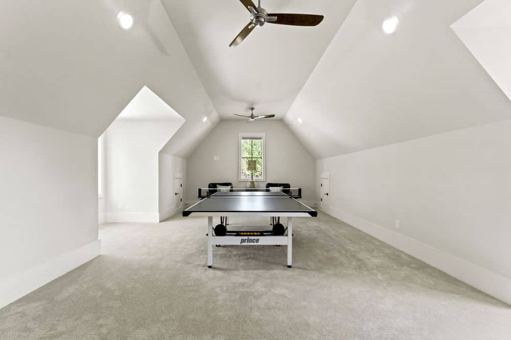 A vaulted ceiling crowns the recreation room.A vaulted ceiling crowns the recreation room.