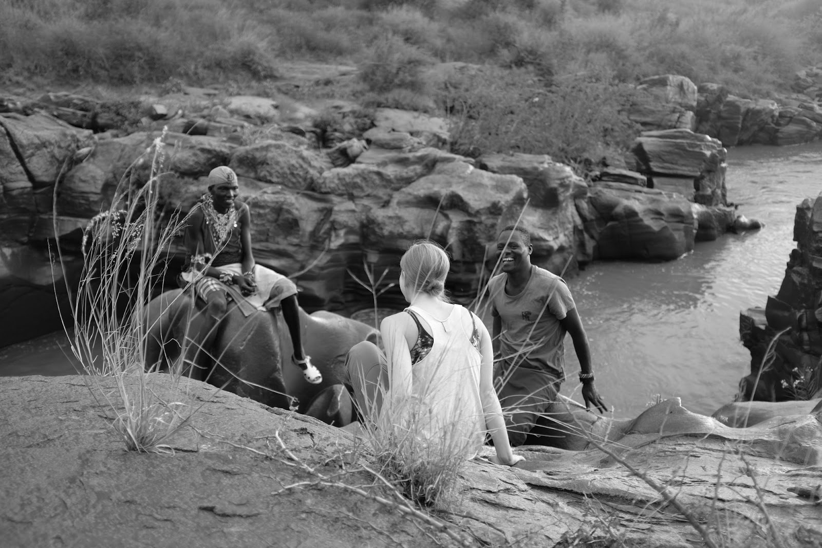 Tourist with tourguides at a watering well in Karisia