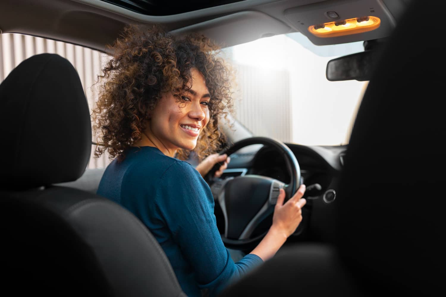a woman driving a car in belgium