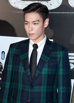 This contains an image of Former BIGBANG member T.O.P's on suit