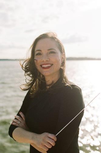 A person smiling at the camera  AI-generated content may be incorrect.