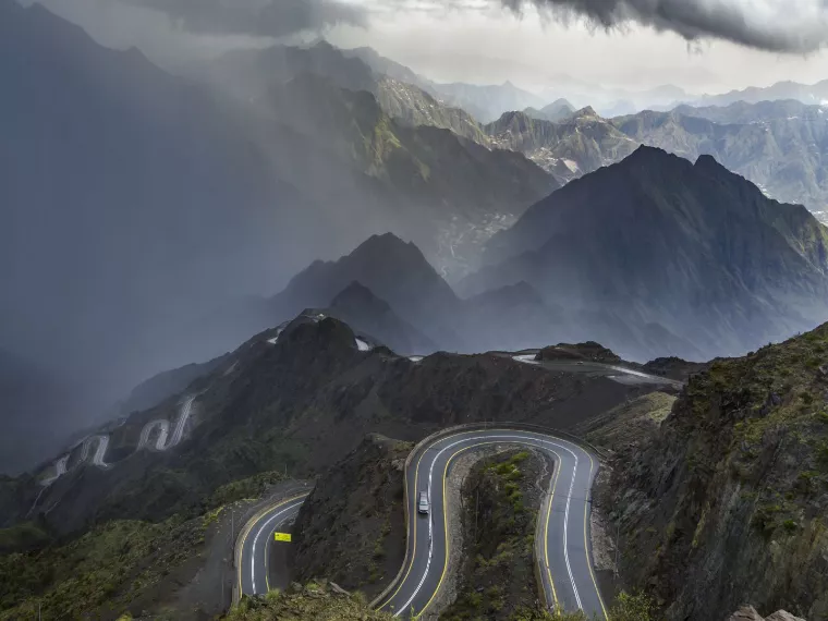 Car driving on a scenic mountain road for an outdoor experience in Aseer, Saudi Arabia - (Credits Visit Saudi)