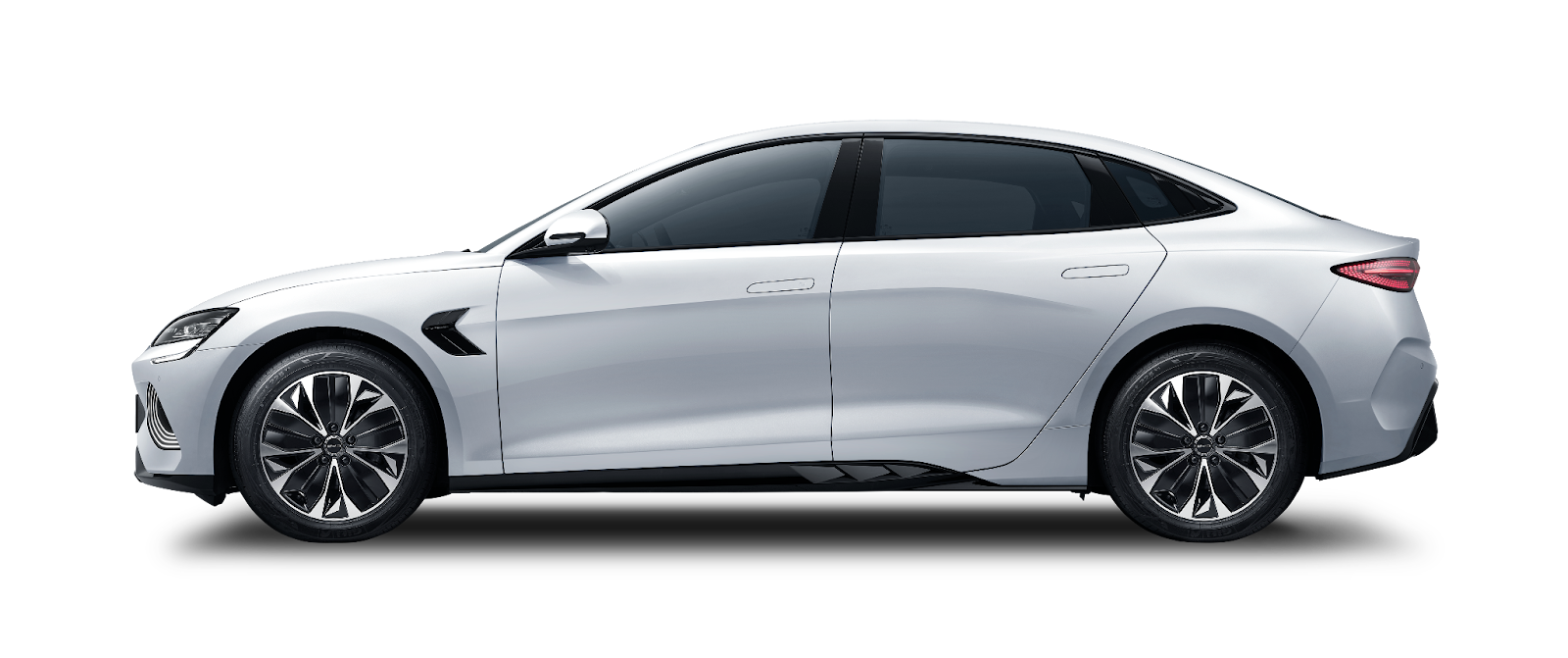 A white car with black background

Description automatically generated