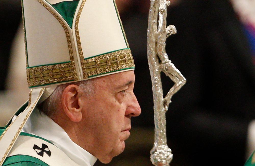 A person in a religious uniform    Description automatically generated