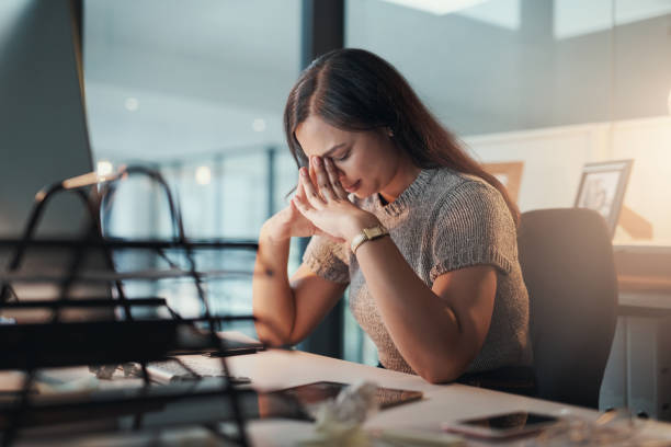 A woman is seen stressed during her work hours.