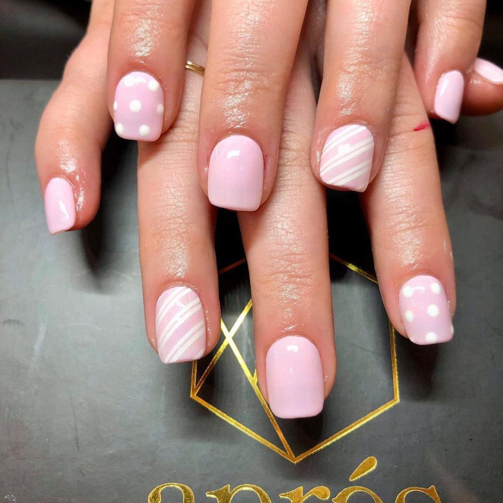 Close up of nails with simple pink nail designs having Light Pink Nail Art