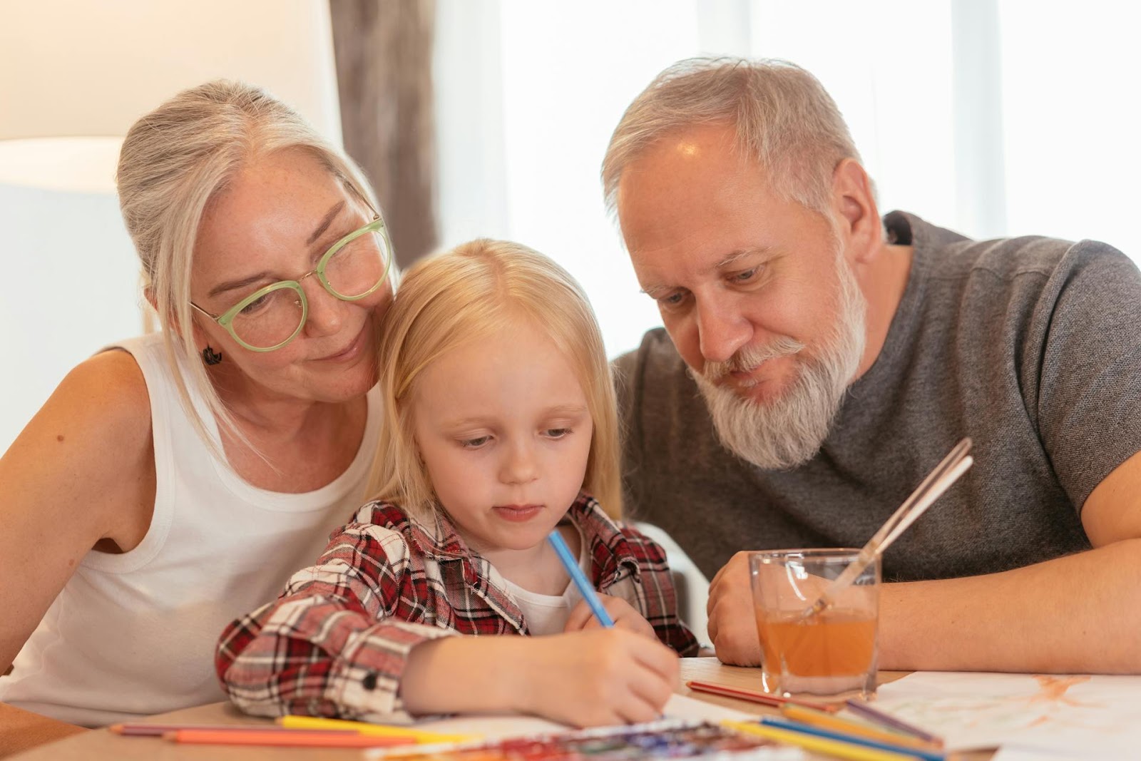 A girl with her grandparents | Source: Pexels